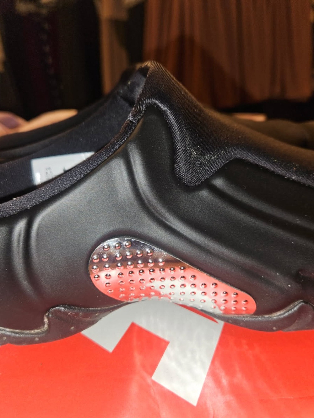 Nike Men’s Black Slip-On Athletic Shoe with Silver and Pink Metallic Accent